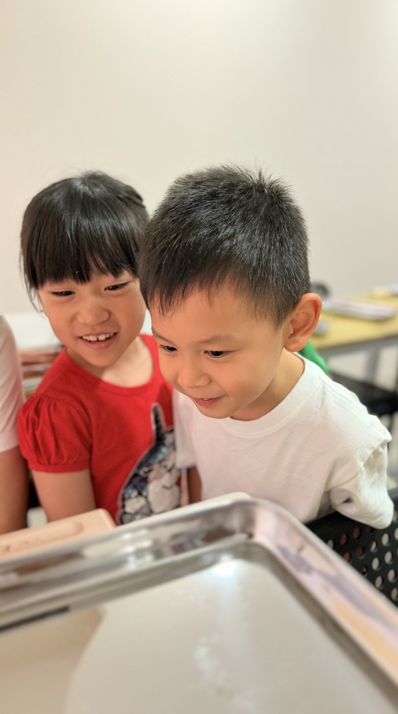 Two Pebbles students reading together